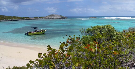 Captain Mingo and his boat Punta Brava behind Icacos