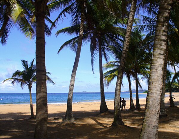 Playa de Luquillo 'Playa Azul' there is a calm beach at the point in the distance